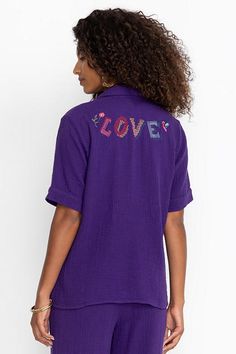 Crafted from 100% breathable cotton, the Desire Camp Shirt is embellished with intricate colorful embroidery at the front and back. Featuring a classic collared button-front, this relaxed-fit casual shirt is finished with a patch pocket at the chest. Pair with linen shorts and strappy sandals for a vibrant weekend look. Johnny Was Women's Camp Shirt in Violet Indigo Purple, Size Small, Linen/Cotton Embroidered Relaxed Fit Collared Blouse, Embroidered Collared Blouse Relaxed Fit, Embroidered Collared Blouse With Relaxed Fit, Embroidered Tops With Relaxed Fit, Embroidered Cotton Collared Tops, Embroidered Cotton Collared Blouse, Cotton Camp Shirt With Floral Embroidery, Cotton Camp Shirt With Collared Neckline, Embroidered Cotton Collar Tops