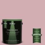 a can of behr marquee paint with a green light coming from it