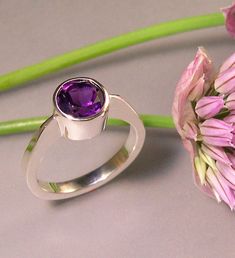 "A stylish, royal purple amethyst that is 8mm, or about 5/16\" in diameter. I hand carve this ring in wax, and then cast it using the lost wax process. Hand carving allows for a much more sculptural feel to the ring. The stone is bezel set....so there is no need to worry about prongs that can \"catch\", or wear out. Amethyst is the birthstone for February. This ring is made to order, so please allow about 2 weeks for delivery." Purple Amethyst Ring, Lace Ring, London Blue Topaz Ring, Rings Cool, Gem Stones, Royal Purple, Metal Work, Lost Wax, Blue Topaz Ring