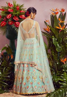 Editor's Note Featuring A Aqua Blue Net Lehenga With Multi Colour Mirror Embroidery, It Comes With A Linear Blouse And Border Dupatta. Fabric: Net Color: Multicolor Care: Dry Clean Only About the Designer Label Aneesh Agarwaal offers regal Indian designs developed with a modern asthetic for the discerning Indian Woman. Blue Net Lehenga, Mirror Lehenga, Indian Outfits Lehenga, Mirror Embroidery, Lehenga Blouse Designs, Blue Lehenga, Net Lehenga, Red Lehenga, Lehenga Blouse