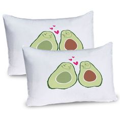 two white pillows with avocados on them