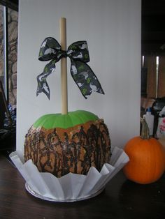 a decorated pumpkin sitting on top of a table