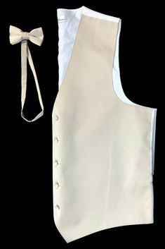 Tan Zelente Tuxedo Vest & Tie Five Button Front with a White Back. Bow Tie is Pre-Tied and Adjustable. Cinches in with a Band in the Back. Durable and Machine Washable. Trusted Very Quick Handling from The Formal Shop. Vest And Bow Tie, Formal Vest, Tuxedo Vest, Church Suits, Vest And Tie, Mens Formal, Wedding Groom, Formal Occasion, Bow Tie