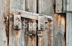 an old wooden door with a lock on it