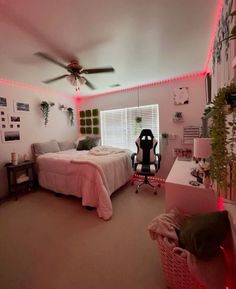 a bedroom with a bed, desk and fan in it's centerpieces