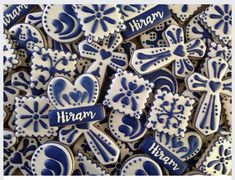 blue and white decorated cookies with names on them