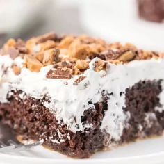 a close up of a piece of cake on a plate with a fork in it