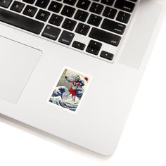 an open laptop computer sitting on top of a white desk