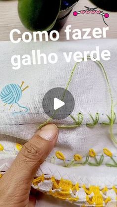 the video shows how to sew fabric with scissors and needleing thread, as well as an image of someone's finger