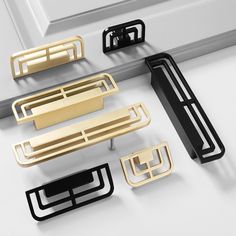 several different types of door handles on a white surface