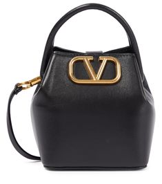 For a timeless style, look no further than Valentino Garavani's VSling Mini tote bag | Valentino Garavani VSling Mini leather tote bag Woven Leather Tote, Valentino Garavani Bag, Patent Leather Ballet Flats, Black Leather Tote Bag, Denim Tote Bags, Denim Tote, Leather Platform Sandals, Mini Tote Bag, Patent Leather Pumps