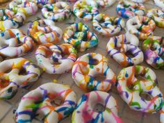 colorful sprinkled donuts are on the table