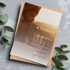 a card with the name william and sophia on it next to some leaves