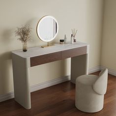 a white vanity table with a mirror and vase on it next to a chair in a room