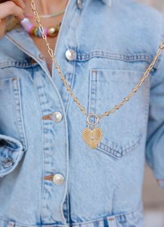 This vintage inspired gold toggle necklace with a heart charm is more than just a pretty piece—it's a daily reminder to love yourself and share that love with the world. The charm hangs on a beautifully unique chain, adding a trendy twist to your everyday look. Whether you’re dressing up or keeping it casual, this necklace is a stylish way to spread love and kindness wherever you go! Features • Gold plated brass • Measures 15.5” plus a 3” extender, 1.5” dropdown heart Everyday Pendant Necklaces With Toggle Clasp, Heart Charm Pendant Necklace For Everyday, Everyday Heart Charm Pendant Necklace, Trendy Everyday Heart Pendant Necklace, Gold Toggle Necklace With Heart Charm As Gift, Gold Plated Heart Charm Pendant Necklace, Dainty Heart Charm Locket Necklace, Heart Charm Chain Necklace For Valentine's Day, Heart Pendant Locket Necklace With Adjustable Chain