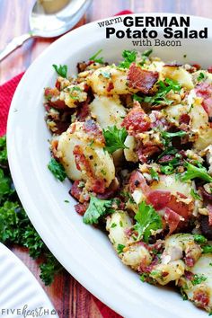 a white plate topped with potatoes and bacon