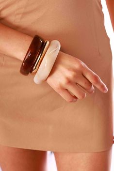 Elevate any look with the Marble Bangles Set. Featuring two marble bangles, this set offers a timeless blend of sophistication and modern style. Bracelet Type: Bangle Marble bangles Set of two Elegant Brown Bangle For Formal Occasions, Elegant Formal Brown Bangle, Chic Brown Bangle Bracelet, Elegant Brown Stackable Jewelry, Marble Bangles, Bronx And Banco, Onyx Marble, Bangles Set, The Marble