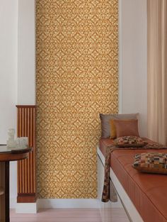 a bed sitting next to a wall with a wooden headboard on top of it