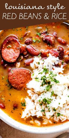 a white bowl filled with red beans and rice next to a plate of sausages