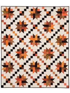 an orange and black quilt with stars on the front, one in the middle is made out of squares