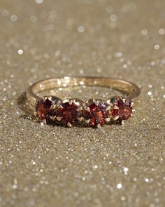 The Solid Gold Four Garnet Ring features four round garnet stones set in prongs with a 9k or 14k solid shank. A reconstructed design of the classic ring, this is the perfect gift for your loved one. Item Details: Available in 9k or 14k Solid Gold 4mm garnet stones 1.8mm band width Available in five sizes Made to order PLEASE NOTE: Our current timeframe for handcrafting this Solid Gold ring is 3-5 weeks before dispatch. Please email us at contact@loveisabelle.com for specific timeframe enquiries. Garnet Aesthetic, Gold Garnet Ring, Solid Gold Ring, Gold Alloys, Garnet Ring, Garnet Stone, Solid Gold Rings, Garnet Rings, Classic Ring