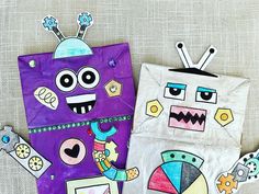 two paper bags with different designs on them and one has an image of a robot