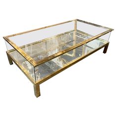 a glass and wood coffee table with metal legs