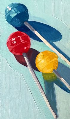 an oil painting of two lollipops on a blue background