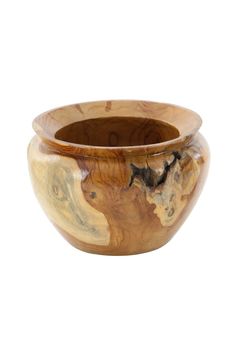 a wooden bowl sitting on top of a white surface