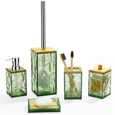 a bathroom set consisting of green glass and bamboo