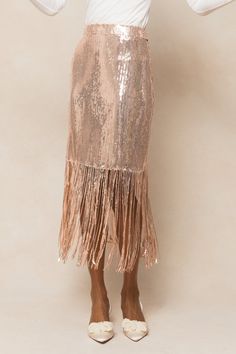 Shine bright in the Ethereal Skirt! This champagne gold sequin midi skirt features a playful fringe trim and a hidden side zipper for a sleek look. Fully lined for comfort, this skirt will have you standing out at any event this holiday season. Ivy City Women's Ethereal Skirt Gold Sequin | Size: XL Ethereal Skirt, Fairytale Party, Sequin Midi Skirt, City Woman, White Dress Party, Fall Kids, Liberty Fabric, Gold Sequin, Fringe Trim