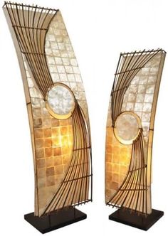 a pair of art deco lamps on stands