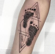 a black and white photo of a person's foot with a triangle on it