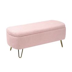 a pink bench sitting on top of a white floor