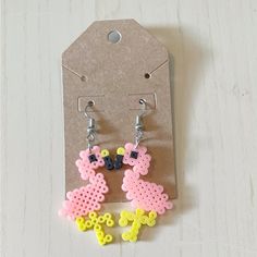 the earrings are made out of plastic beads