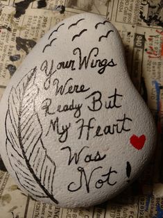 a rock with writing on it that says, your wings were ready but my heart was not