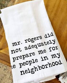 a tea towel that says mr rogers did not adequately prepare me for the people in my neighborhood