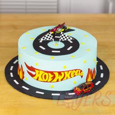 a birthday cake with a hot wheels theme