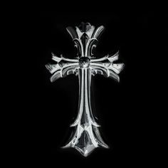 a glass cross on a black background