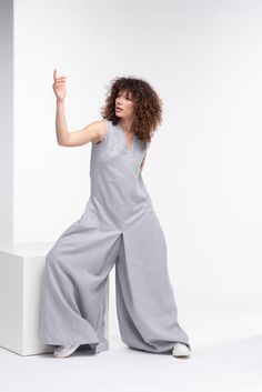 "This modern and comfortable jumpsuit is crafted from cool, breathable linen material for ultimate comfort throughout the day. Featuring sleeveless design, side pockets and hidden zipper on the back for closure. This model is so comfortable and at the same time super elegant and chic. You can style it with high wedges or some flats. Effortless style has never been easier. The model in the picture is 176cm. ⅼ 5.8 ft. tall and is wearing size S / color: Light gray 🌟 INFO: * Worldwide EXPRESS ship Fitted Linen Jumpsuits And Rompers For Spring, Spring Fitted Linen Jumpsuits And Rompers, Linen V-neck Jumpsuits And Rompers For Spring, Relaxed Fit Linen Jumpsuit With V-neck, Spring Linen Jumpsuit With V-neck, Spring Linen V-neck Jumpsuit, Fitted Linen Jumpsuits And Rompers For Loungewear, Japanese Pants, Harem Romper