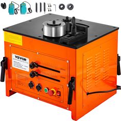 an orange and black machine with tools on it