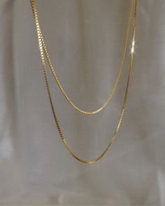 thin gold classic box chain necklace Double Strand Box Chain Necklace For Gift, Double Strand Box Chain Necklace For Gift Giving, Gift Double Strand Box Chain Necklace, Dainty Gold-plated Box Chain Necklace, Gold Double Strand Box Chain Necklace, Gold Jewelry Box Chain For Layering, Gold Box Chain Jewelry For Layering, Yellow Gold Box Chain Jewelry For Layering, Dainty Box Chain Jewelry For Layering