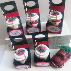 six gift bags with coffee in them on top of a wooden box next to a toy car