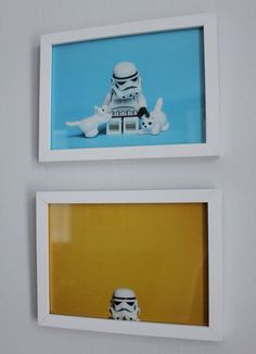 two framed photos of stormtroopers on the wall