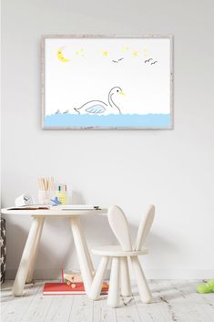 a white table and chair in front of a wall with a painting on the wall