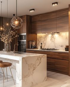 a modern kitchen with marble counter tops and wooden cabinetry, along with pendant lights hanging from the ceiling