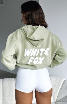 If your aesthetic is comfy but cool you will love the Offstage Hoodie in Moss. This hoodie is an oversized fit and features elasticated ribbed cuffs & hem, hood, soft fleeced fabric for extra comfort and a puff print logo centre front. Complete the tracksuit set with bike shorts and sneakers for the ultimate off-du White Fox Green Hoodie, White Fox Hoodie, Fox Clothing, Birthday Outfits, Usa Outfit, Green Hoodie, Tracksuit Set