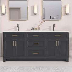 a bathroom vanity with two mirrors above it and lights on the wall next to it