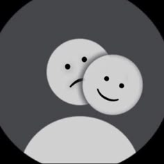 two white smiley faces in a black and gray circle, with one looking at the camera