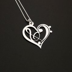 G clef & bass clef heart Design necklace pendant. If you are looking for good gift for some of your friend who is musician i think this necklace is perfect for that. Item Description : Material: Sterling Silver (925) Size of pendant : around 1 inch Finish: Bright Satin Finish Chain Material: 925 Sterling Silver Italian Box chain Thank you for looking. Please feel free to contact me any time for any reason and concern . Music Note Necklace, Heart Necklace Silver, Bass Clef, Jewelry Advice, Heart Shaped Jewelry, Musical Notes